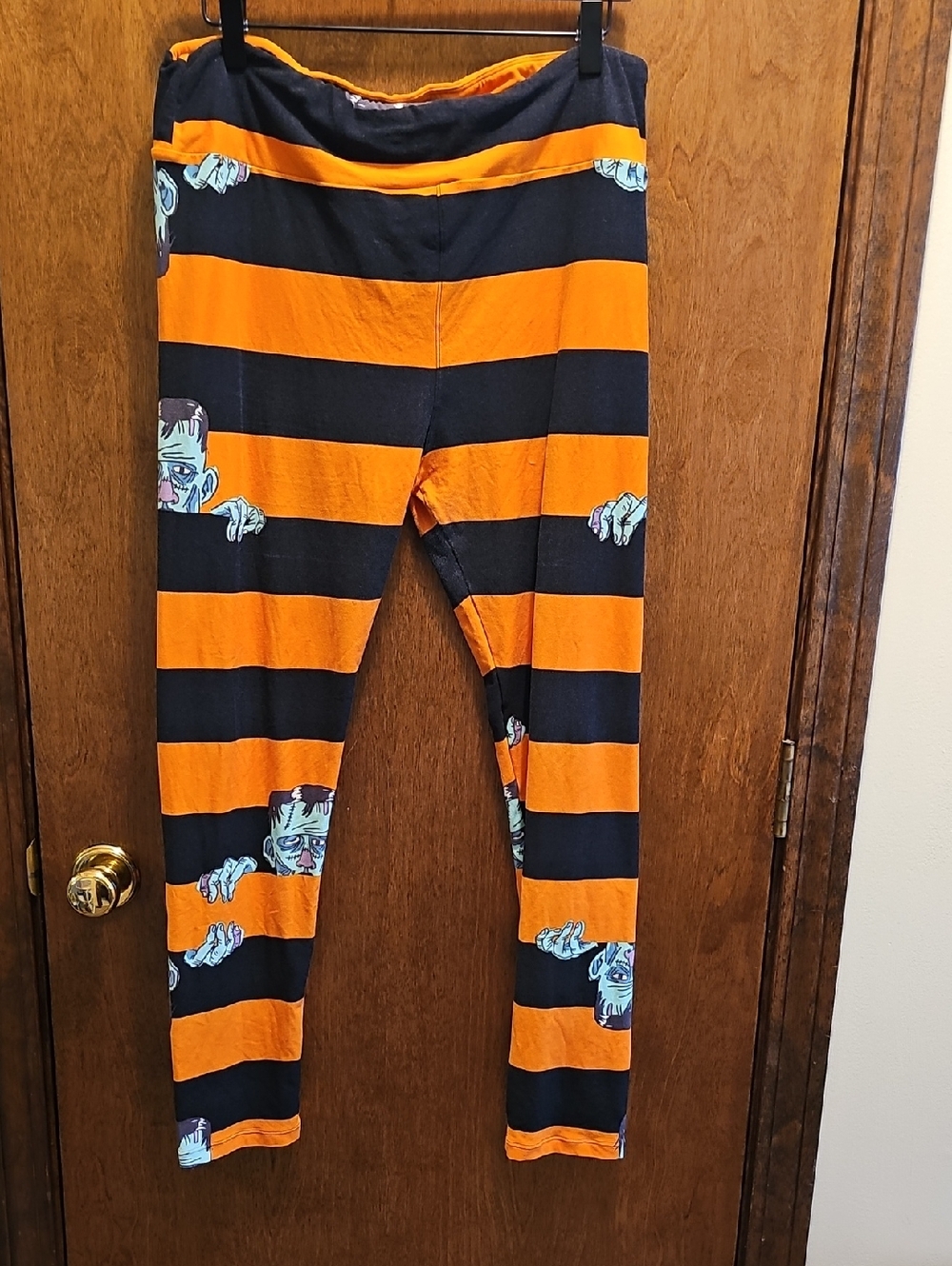 LuLaRoe Orange and Black Striped Halloween Leggings with Monster Print